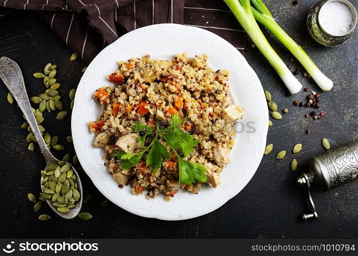 qinoa porridge with vegetables on white plate