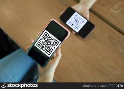 Qr code payment. E wallet. Woman scanning QR code online shopping cashless technology concept