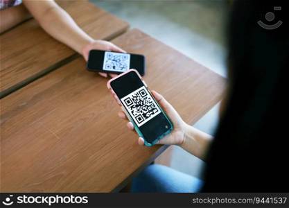 Qr code payment. E wallet. Woman scanning QR code online shopping cashless technology concept
