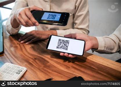 Qr code payment. Woman scanning QR code online shopping cashless technology concept