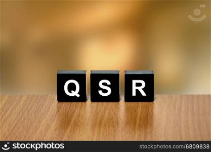 QSR or Quick service restaurant on black block with blurred background