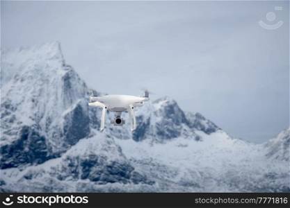 Quadcopter drone with digital camera in mountains. Drone with digital camera