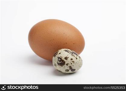 Quail egg with a chicken egg