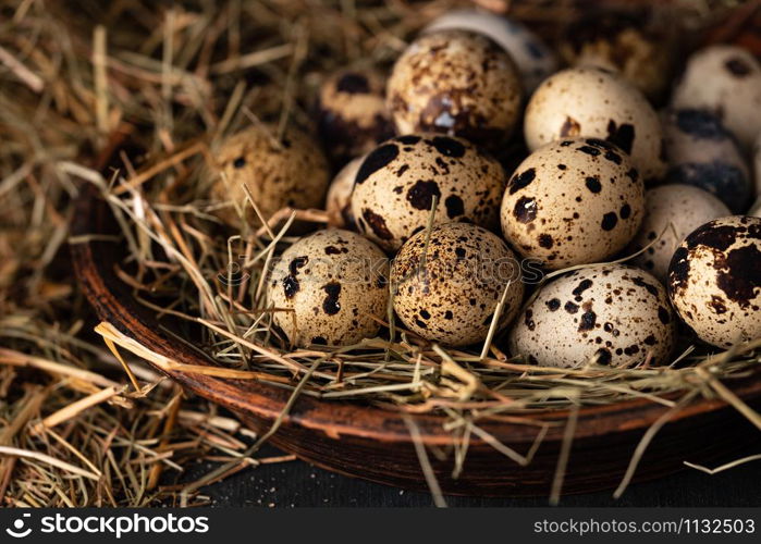 Quail eggs in a straw nest