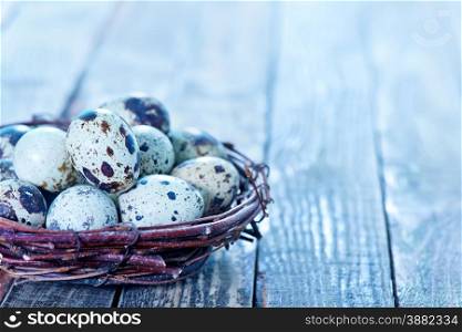 quail eggs in the nest and on a table