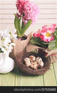 Quail eggs in the nest, the symbol of spring and flowers