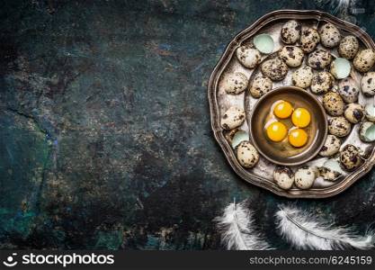Quail eggs in vintage plate on rustic background, top view, place for text. Quail eggs cooking.