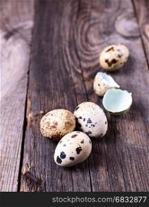 Quail eggs on a wooden surface, close up