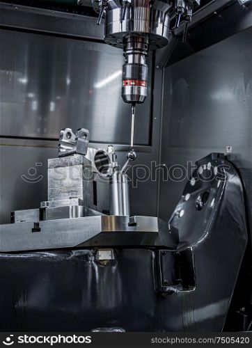 Quality control measurement probe. Metalworking CNC milling machine. Cutting metal modern processing technology.