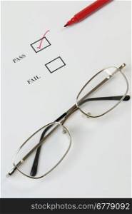 Quality control or exam check list with tick, red pen and glasses
