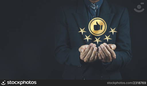 Quality product symbol in the hand of a business man.Hand shows the sign of the top service Quality assurance, Guarantee, Standards, ISO certification and standardization concept.