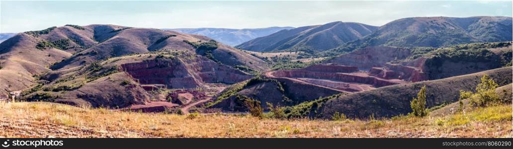Quarry red marble.. Opencast mining rare red marble. Panorama shooting.