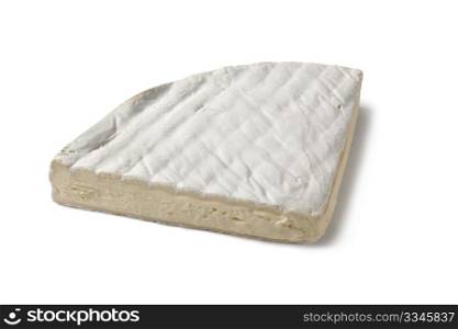Quarter of French Brie cheese on white background