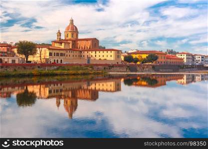 Quay of the river Arno in Florence, Italy. Quay of the river Arno in Florence and church San Frediano in Cestello on the background, Tuscany, Italy