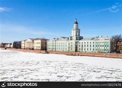 quay with Kunstkamera and Academy buildings. view of Universitetskaya Quay with Kunstkamera and Academy of Sciences buildings on Vasilievsky Island in St Petersburg city from the Palace Bridge in sunny march day