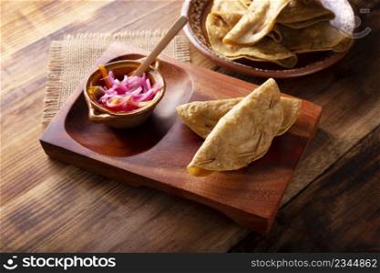 Quesadillas Doradas. Fried quesadillas made with corn tortillas, they can be filled with any dish or ingredient, such as meat, potato or fish such as marlin or tuna, popular during the Lenten season.