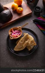Quesadillas Doradas. Fried quesadillas made with corn tortillas, they can be filled with any dish or ingredient, such as meat, potato or fish such as marlin or tuna, popular during the Lenten season.