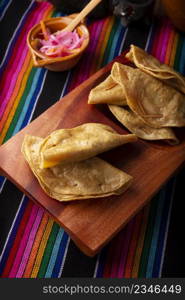 Quesadillas Doradas. Fried quesadillas made with corn tortillas, they can be filled with any dish or ingredient, such as meat, potato or fish such as marlin or tuna, popular during the Lenten season.