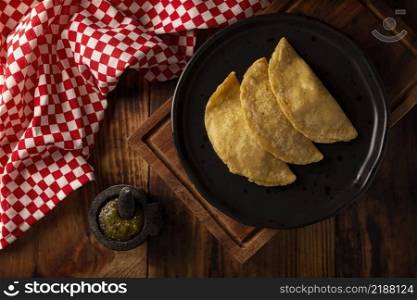 Quesadillas fritas. Traditional Mexican appetizer  garnacha . Deep Fried handmade corn tortilla that can be filled with a wide variety of ingredients, cheese, pork rinds, meat, etc. 