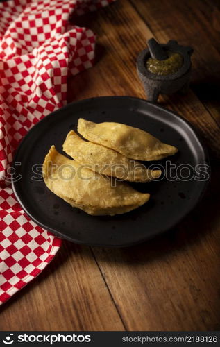 "Quesadillas fritas. Traditional Mexican appetizer "garnacha".Deep Fried handmade corn tortilla that can be filled with a wide variety of ingredients, cheese, pork rinds, meat, etc. "