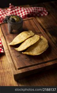 "Quesadillas fritas. Traditional Mexican appetizer "garnacha".Deep Fried handmade corn tortilla that can be filled with a wide variety of ingredients, cheese, pork rinds, meat, etc. "