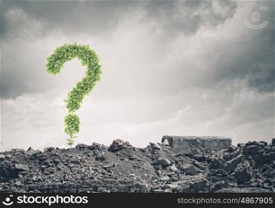 Question concept. Conceptual image with green question mark growing on ruins