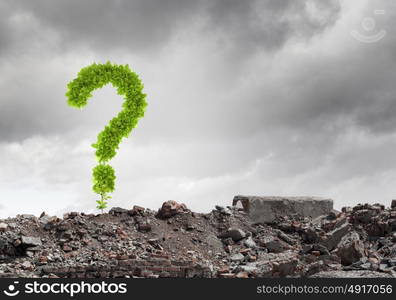 Question concept. Conceptual image with green question mark growing on ruins