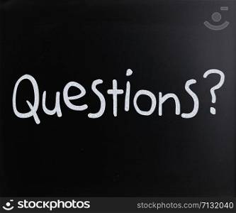 ""Question" handwritten with white chalk on a blackboard"