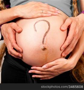 question. Male and female hands are embracing stomach of a pregnant woman on gray background with caption on stomach