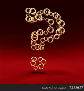Question mark. Question mark made of golden rings on the red background