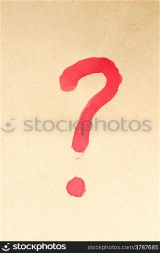 Question mark symbol written on brown paper