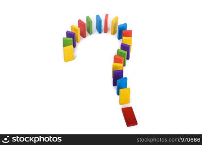 Question mark with colored wooden dominos on a white background