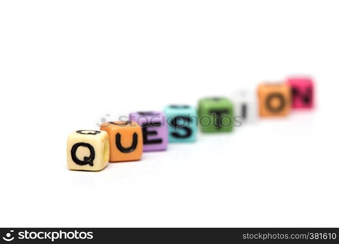 question - word made from multicolored child toy cubes with letters