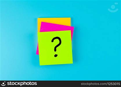 Questions Mark ( ? ) word in paper note on blue background. FAQ( frequency asked questions), Answer, Q&A, Communication and Brainstorming, International Ask a Question day Concepts