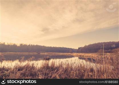 Quiet lake in the sunrise at wintertime