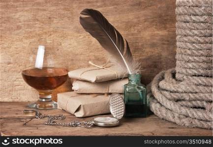 quill in the inkwell and glass of wine