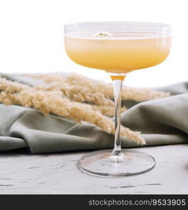 quince cocktail in a glass isolated