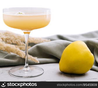 quince cocktail in a glass isolated