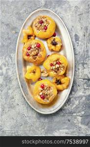 Quince stuffed with raisins and walnuts.Baked quince.Autumn food. Baked quince stuffed with nuts