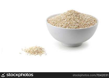 quinoa in white ceramic bowl isolated on white background