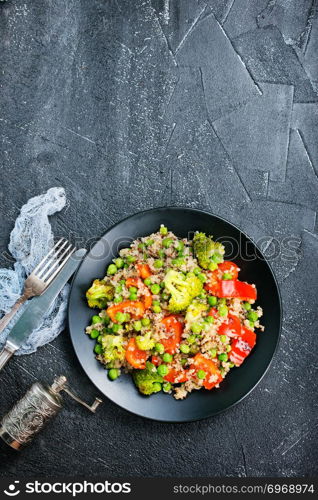 Quinoa salad with pepper, avocado , broccoli and oil . Vegan superfood