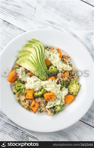 Quinoa salad with roasted vegetables and fresh avocado