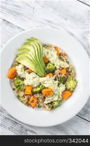 Quinoa salad with roasted vegetables and fresh avocado