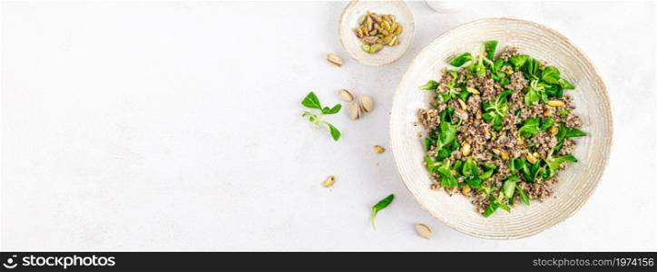 Quinoa with corn salad and pistachios. Healthy food. Top view. Banner.