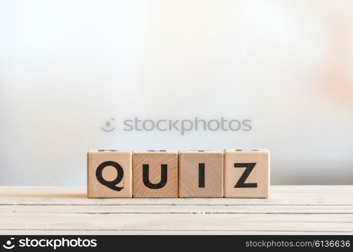 Quiz sign made of wood on a wooden table
