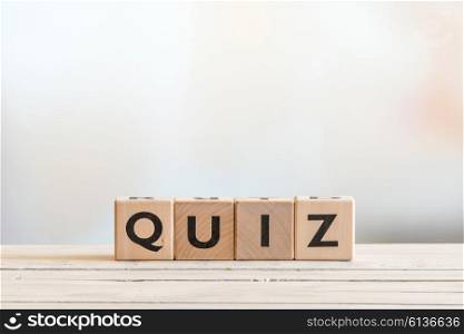 Quiz sign made of wood on a wooden table