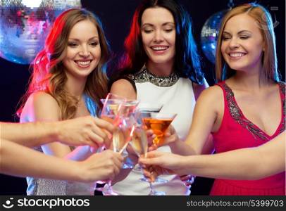 &quot;new year&quot;, celebration, friends, bachelorette party, birthday concept - three women in evening dresses with cocktails in club or bar