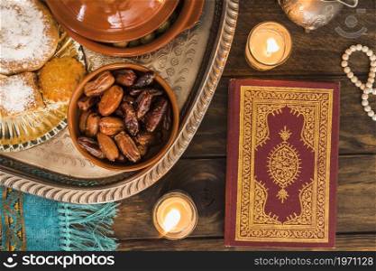 quran candles near arabic food. High resolution photo. quran candles near arabic food. High quality photo