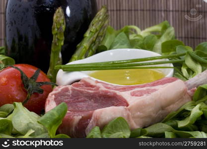 Rack of lamb and ingredients. a food background with a rack of lamb and different ingredients