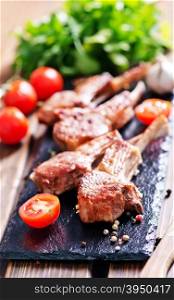 Rack of lamb fried with aromatic olive oil, herbs and spices